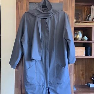 Rain jacket with detachable scarf.